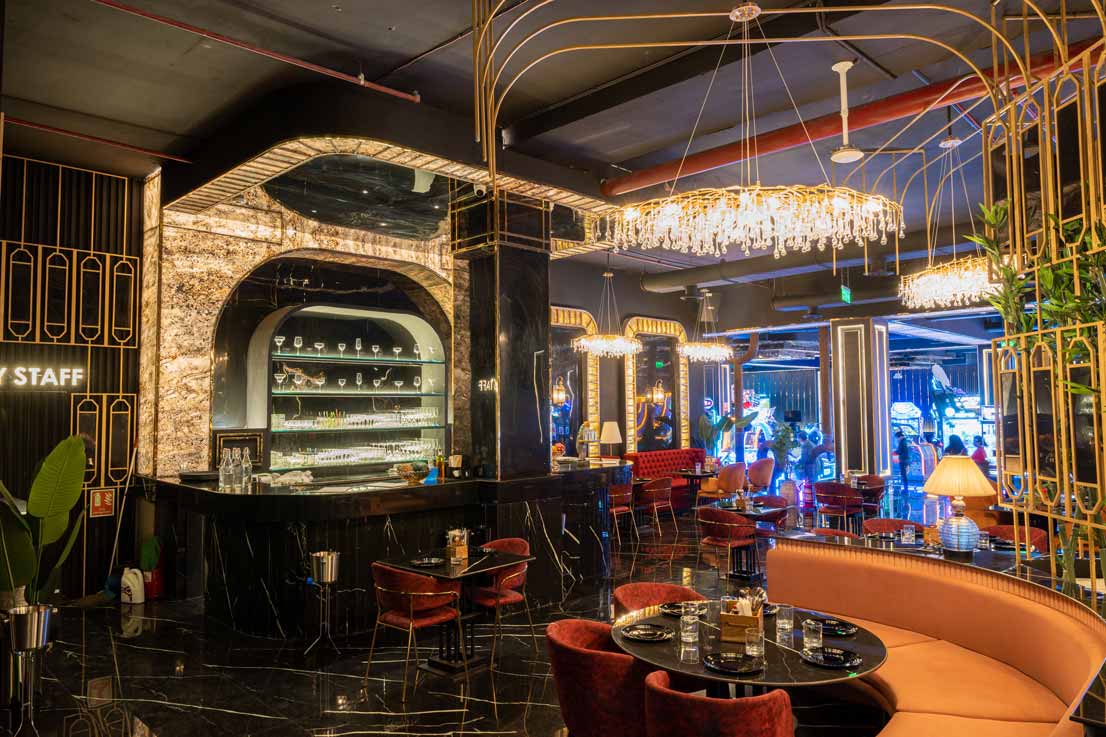 Lively scene of friends bowling and enjoying food at The Game Palacio in Viviana Mall