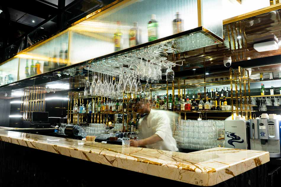 Exterior shot of The Game Palacio Krystal Building, Bandra at night, glowing lights