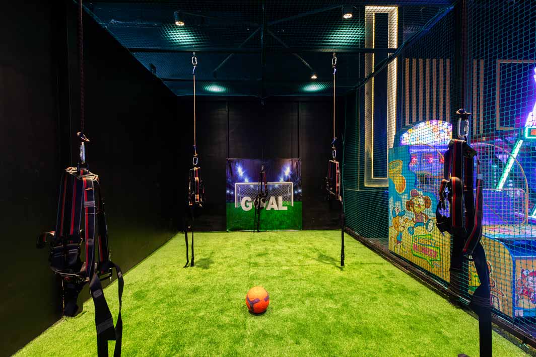 Kids and adults playing games at The Game Palacio game zone in Elante Mall