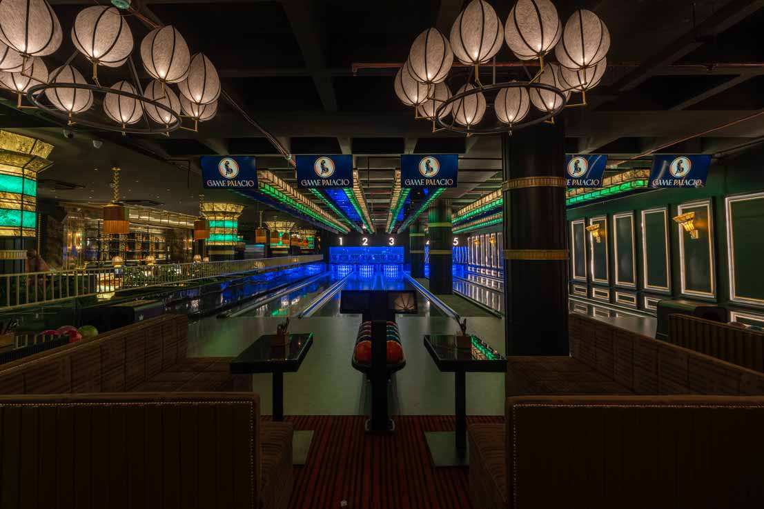 Students laughing and bowling at The Game Palacio game center in Ansal Plaza Mall, Delhi