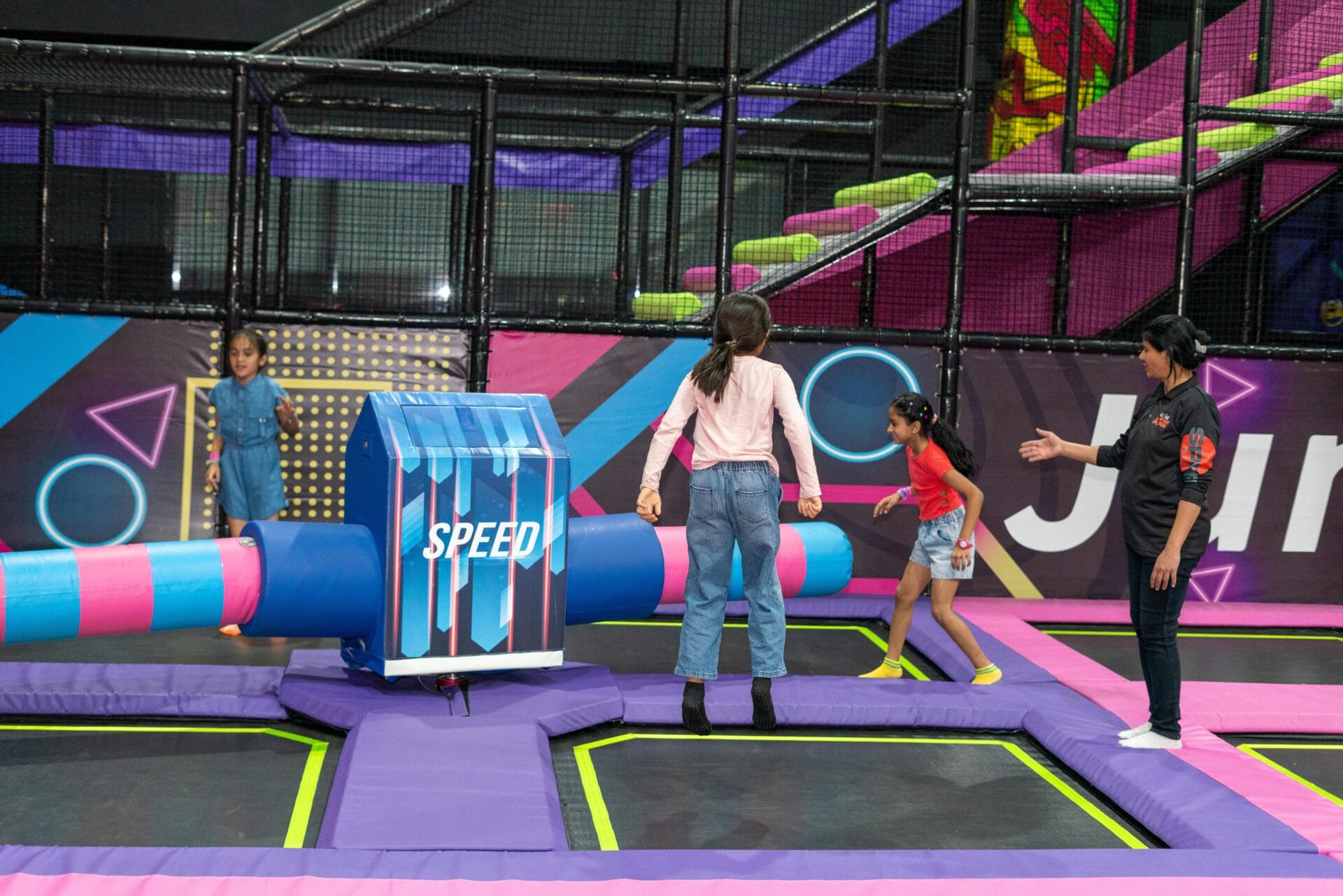 Kids having fun at a trampoline park birthday party in Pune with colourful decorations and games