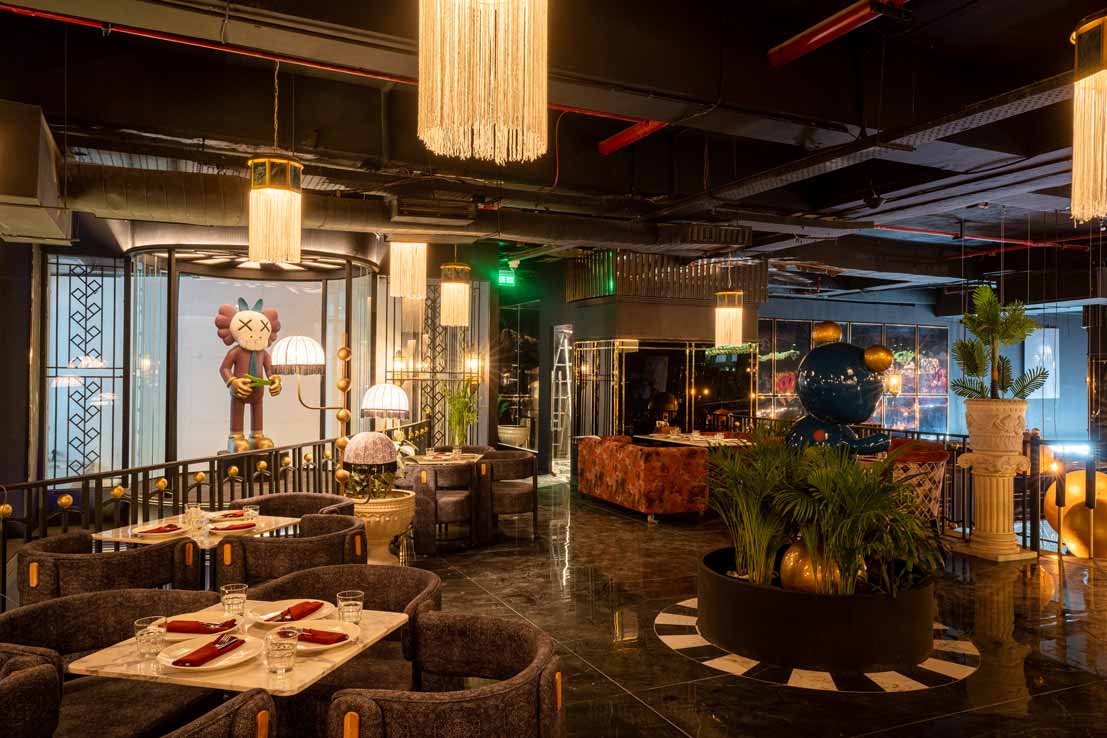 A group of friends shouting "surprise!" at a birthday party inside The Game Palacio in Noida