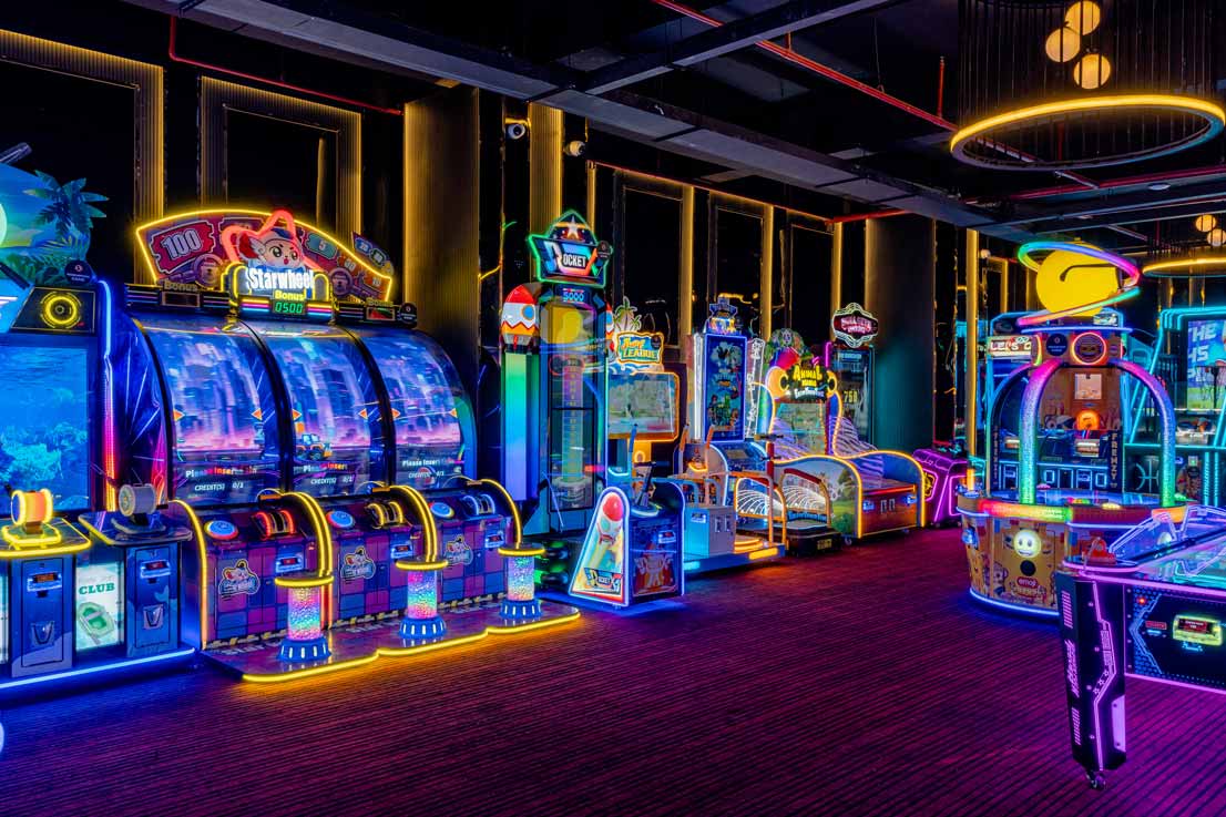 Family enjoying bowling and arcade games at The Game Palacio family entertainment center in Pitampura
