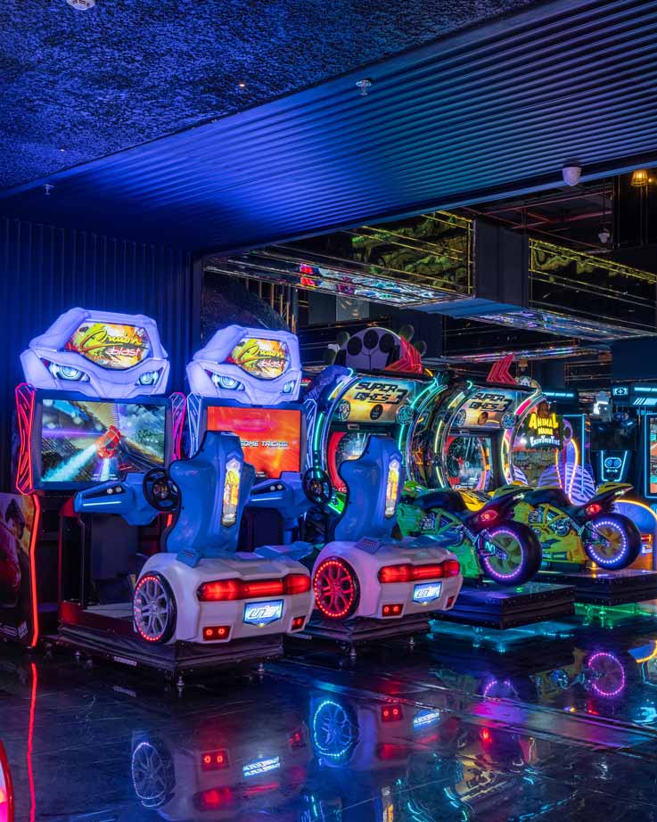 Family enjoying quality time together at The Game Palacio entertainment hub playing arcade games and bowling